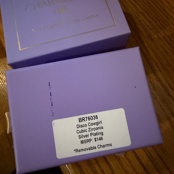 Charming Silver Bracelet with Unique Charms - Picture 2 of 2